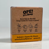 Back side of the Gentle Body Bar box. Box is kraft paper colored with orange accents.