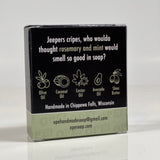 Front side of the Jeepers Cripes soap. Quote on box says, "Jeepers cripes, who woulda thought rosemary and mint would smell so good in soap?" Box is black with light mint green accents.