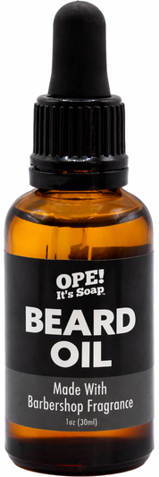 Amber glass Barbershop Beard Oil bottle with black dropper and a black and charcoal label featuring the Ope! It’s Soap logo.