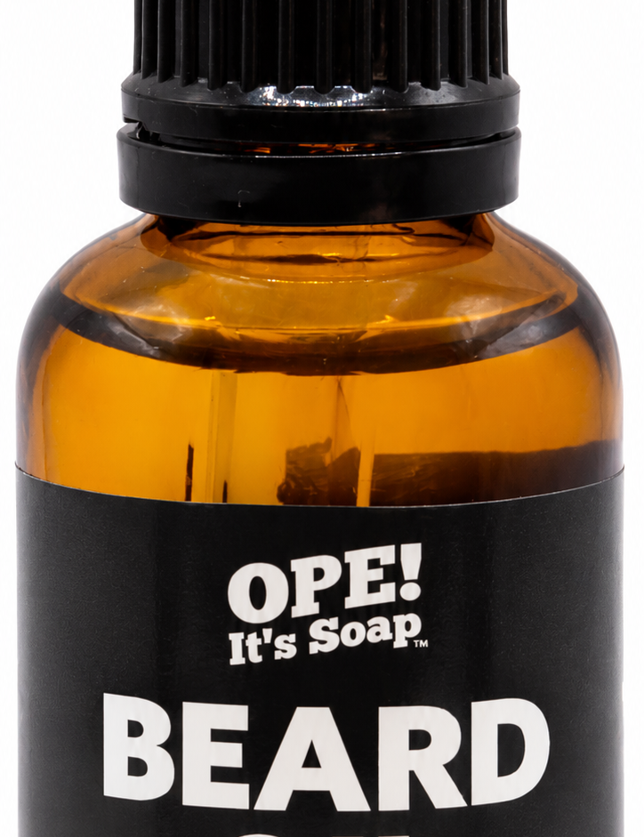 Amber glass Bergamot & Cedarwood Essential Oils Beard Oil bottle with black dropper and a black and yellow Ope! It’s Soap label.