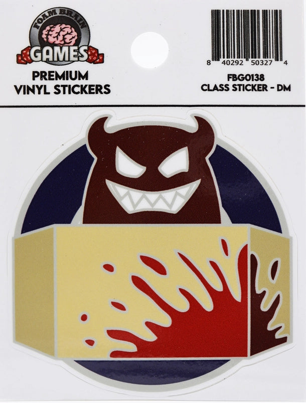 Foam Brain Games Dungeon Master vinyl sticker featuring a grinning, horned red demon with sharp white teeth peeking over a yellow dungeon master screen splattered with red, against a dark blue circular background.