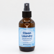 Clean Laundry Room & Linen Spray in an amber spray bottle with a light blue label, handmade by Coleman & Peck in Chippewa Falls, Wisconsin.