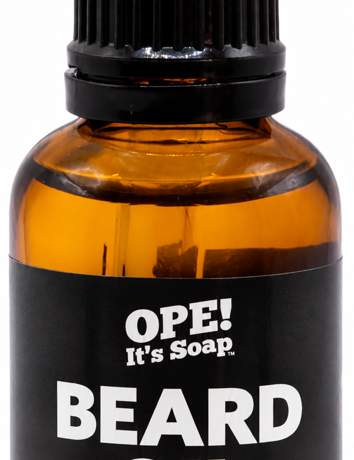 Amber glass Clove Essential Oil Beard Oil bottle with black dropper and a black and warm brown Ope! It’s Soap label.