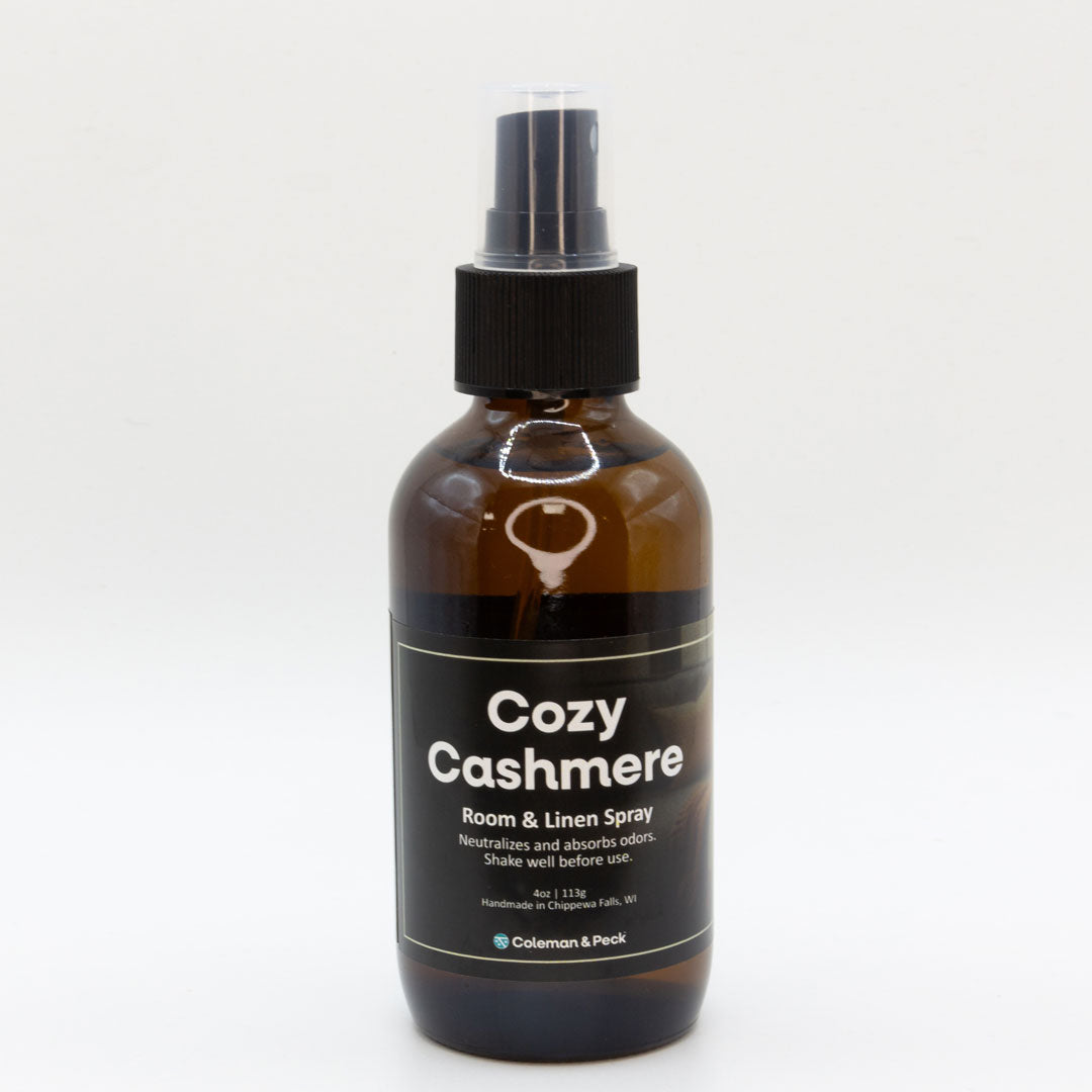 Front view of Cozy Cashmere room & linen spray bottle. A single bottle is shown.