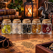 Five glass spell jars filled with colorful polyhedral gaming dice and silver charms, displayed on a wooden table with a fantasy map, antique books, glowing lantern, and dragon figurine in a cozy tabletop RPG setting.
