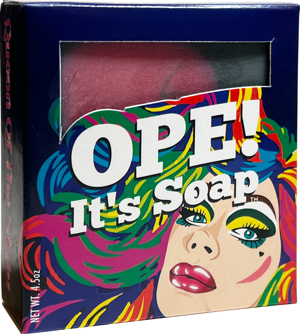 Ope! It’s Soap soap box featuring a colorful pop art portrait with bold makeup and vibrant pink, green, blue, and yellow accents, with a window revealing the pink soap inside.