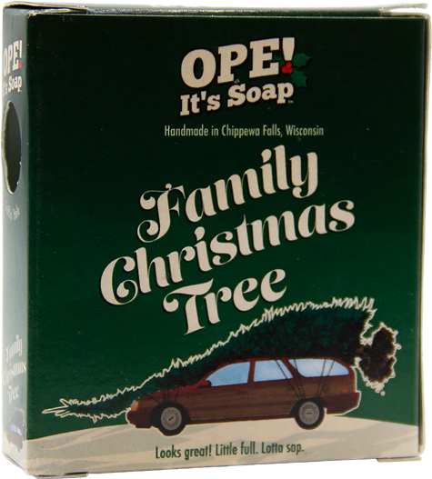 Ope! It’s Soap Family Christmas Tree soap box featuring a station wagon hauling an oversized Christmas tree against dark green packaging, with the tagline “Looks great! Little full. Lotta sap.”