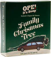 Ope! It’s Soap Family Christmas Tree soap box featuring a station wagon carrying an oversized Christmas tree against dark green packaging, with the tagline “Looks great! Little full. Lotta sap.”