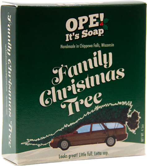 Ope! It’s Soap Family Christmas Tree soap box featuring a station wagon carrying an oversized Christmas tree against dark green packaging, with the tagline “Looks great! Little full. Lotta sap.”