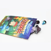 Open Foam Brain Games Friendly Fungi Mystery Loot packet lying on a white background, with a purple mushroom character enamel pin and two smaller mushroom-themed pins spilling out of the colorful packaging.
