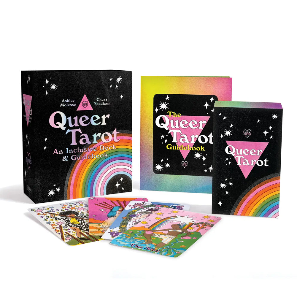 Queer Tarot deck and its included book set on a clean white background. The set includes a black tarot box with a pink triangle and rainbow, a colorful guidebook, a tarot card deck, and a guidebook, all featuring vibrant rainbow artwork and whimsical illustrations.
