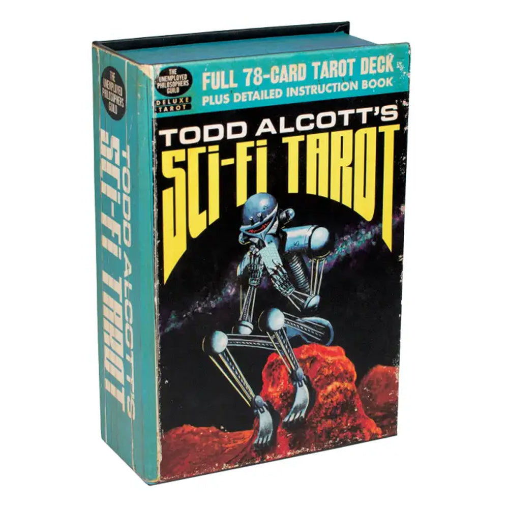 A vintage boxed tarot deck book titled "Todd Alcott's Sci-Fi Tarot" with a teal spine and cover, yellow title text, and sci-fi artwork of a metallic robot on a red rocky landscape against a black background.