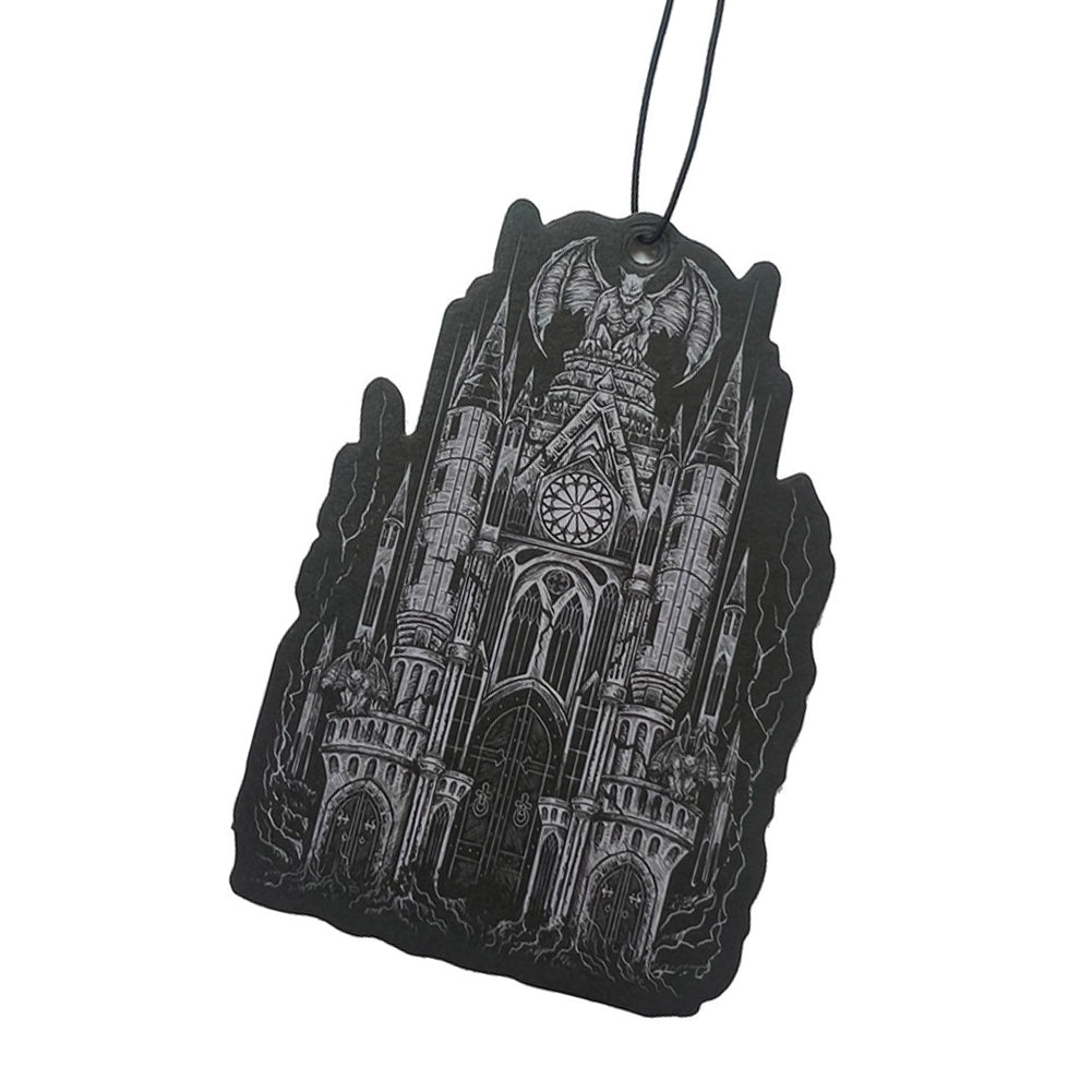 Black hanging car air freshener with detailed gray artwork of a gothic cathedral featuring pointed towers, arched windows, and gargoyles. Musk scented.