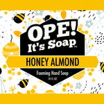 Bees, honeycombs and almonds surrounding honey almond soap label