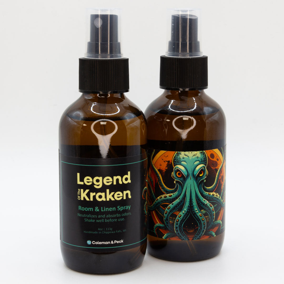 A pair of Legend of the Kraken room & linen spray bottles, showing both sides of the label.