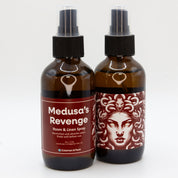 A pair of Medusa's Revenge room & linen spray bottles, showing both sides of the label.