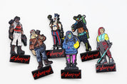 Six Cyberpunk RED Gangs & Gear collectible character pinatures featuring futuristic gang members in colorful streetwear and combat gear, each mounted on a black Cyberpunk RED display base.