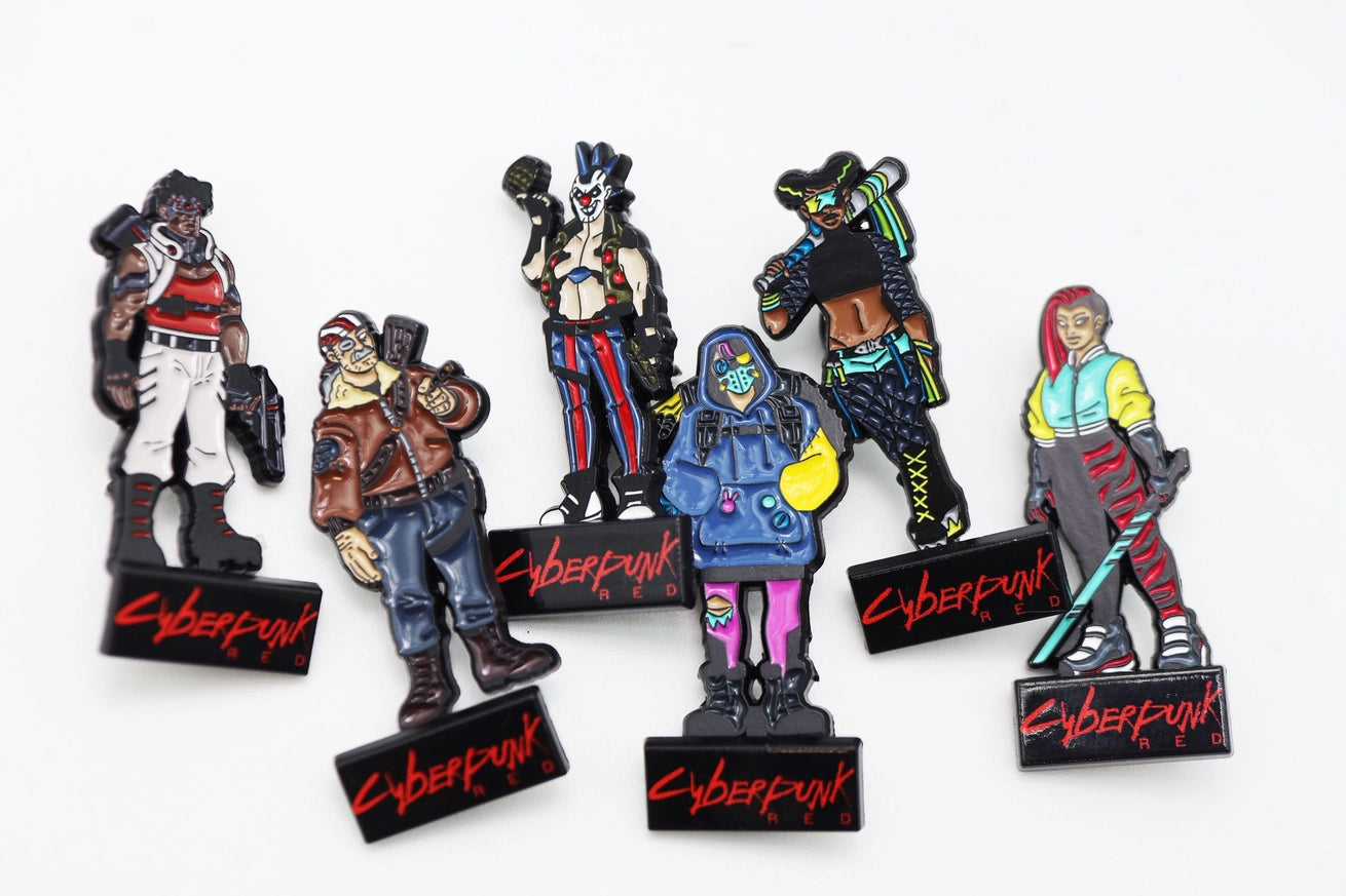 Six Cyberpunk RED Gangs & Gear collectible character pinatures featuring futuristic gang members in colorful streetwear and combat gear, each mounted on a black Cyberpunk RED display base.