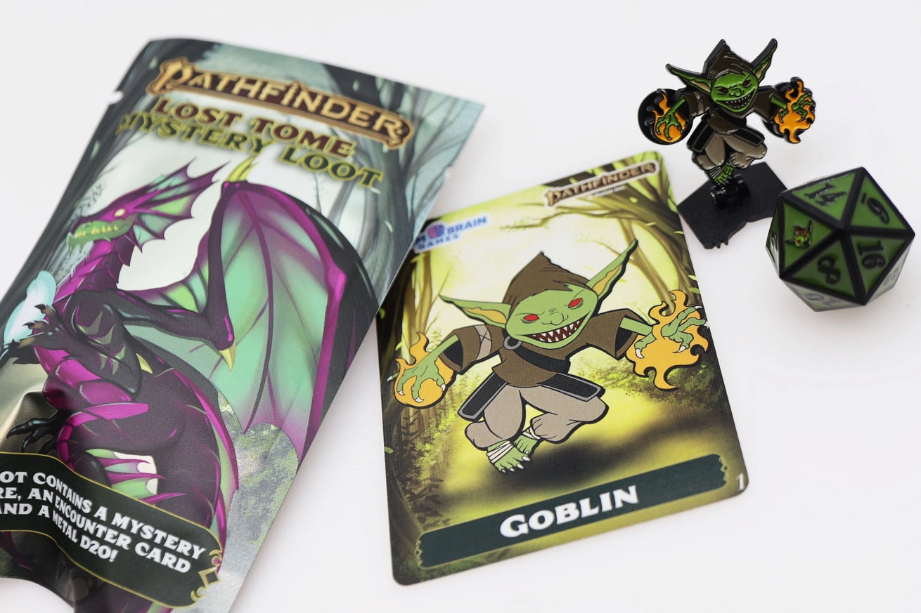 Pathfinder Lost Tome Mystery Loot collection featuring a green goblin pinature with flaming hands, matching Goblin encounter card, green and black metal D20, and dragon-themed mystery packaging.