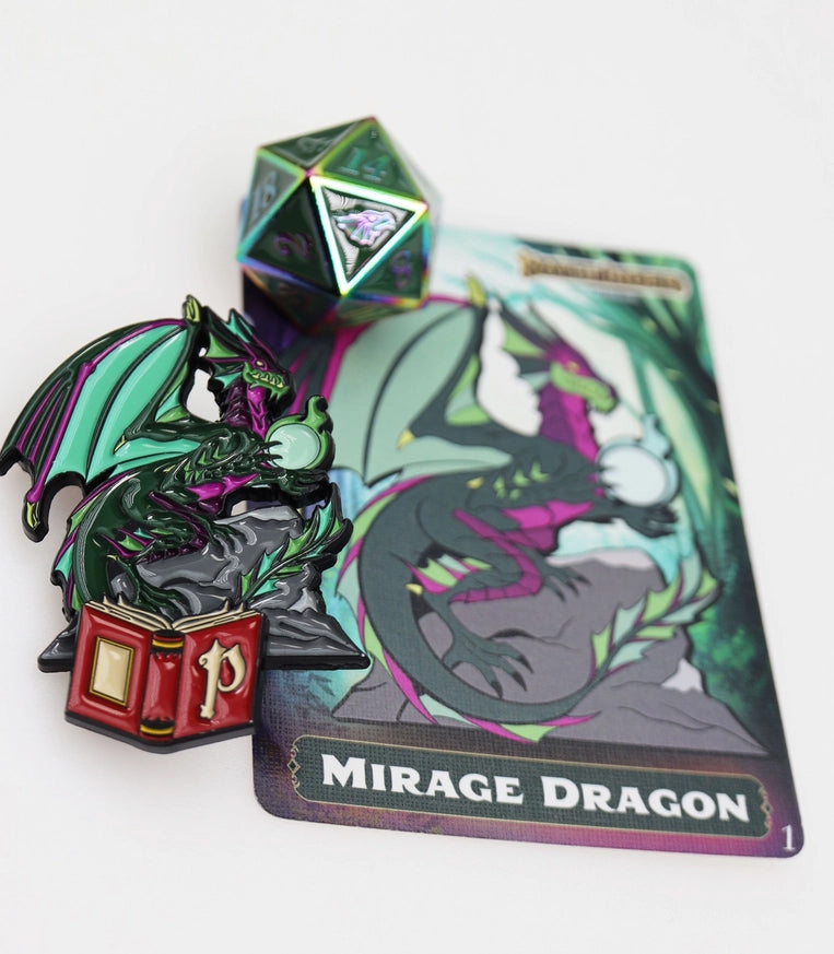 Pathfinder Lost Tome Mystery Loot Mirage Dragon set featuring a green and purple dragon pinature perched above an open red book, matching illustrated encounter card, and iridescent metal D20 die.