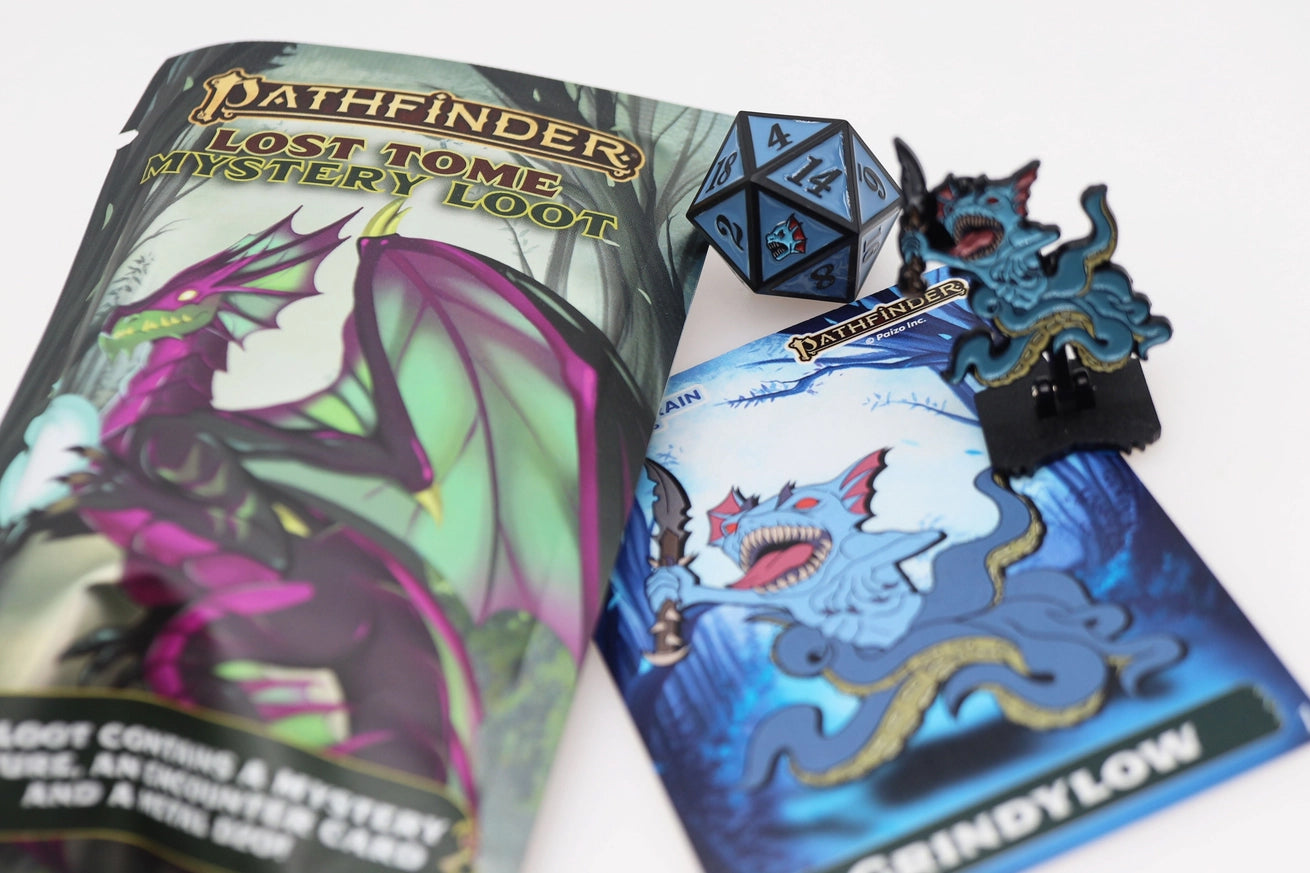 Pathfinder Lost Tome Mystery Loot featuring a blue Grindylow monster pinature, matching illustrated encounter card, blue and black metal D20 die, and dragon-themed mystery packaging on a white background.