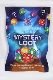 Blue Foam Brain Games Mystery Loot blind bag featuring colorful polyhedral dice illustrations and question marks. Each mystery pack contains a plastic RPG dice set and one metal die.