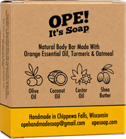 Back of the Ope! It’s Soap Natural Body Bar box featuring orange essential oil, turmeric, and oatmeal, with illustrations highlighting olive oil, coconut oil, castor oil, and shea butter.