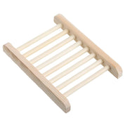 A light, natural-colored bamboo soap holder with eight slats, shown on a plain white background.