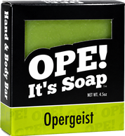 Ope! It’s Soap Opergeist soap box featuring bold black and lime green packaging with a window revealing the green sage soap bar inside.