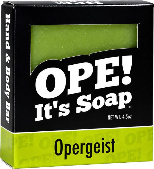 Ope! It’s Soap Opergeist soap box featuring bold black and lime green packaging with a window revealing the green sage soap bar inside.