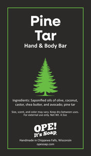 Pine Tar Hand & Body Bar ingredient card featuring a green pine tree on a charcoal background, with ingredients, product care information, and Ope! It’s Soap branding.