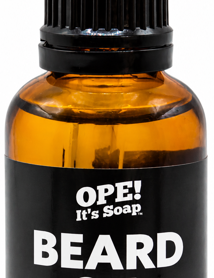 Amber glass Sandalwood Essential Oil Beard Oil bottle with black dropper and a black and warm tan Ope! It’s Soap label.