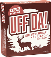Ope! It’s Soap Uff Da hand and body bar box featuring rustic red and cream packaging with a buck and Northwoods scenery, made with rustic woods fragrance and red French clay.