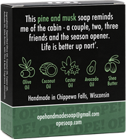 Back of the Ope! It’s Soap Up Nort’ soap box featuring a pine and musk cabin-inspired description, illustrated ingredient icons, and green and black packaging with “Handmade in Chippewa Falls, Wisconsin.”