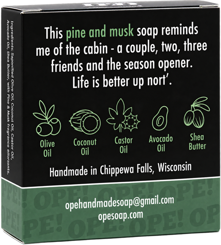 Back of the Ope! It’s Soap Up Nort’ soap box featuring a pine and musk cabin-inspired description, illustrated ingredient icons, and green and black packaging with “Handmade in Chippewa Falls, Wisconsin.”