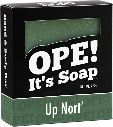 Ope! It’s Soap Up Nort’ hand and body bar in black and forest green packaging, with a window showing the speckled green soap bar inside.