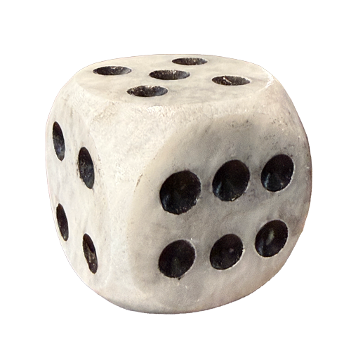 Close-up of an oversized white marble decorative die with rounded edges, natural gray veining, and recessed black dots, showing its polished stone texture.