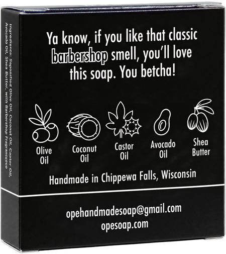 Back of the Ope! It’s Soap You Betcha! soap box featuring the tagline “Ya know, if you like that classic barbershop smell, you’ll love this soap. You betcha!” with illustrated olive oil, coconut oil, castor oil, avocado oil, and shea butter ingredients.