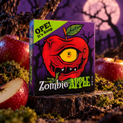 Zombie Apple soap box displayed on a mossy tree stump surrounded by red apples, twisted branches, and a glowing full moon in a spooky purple nighttime setting.