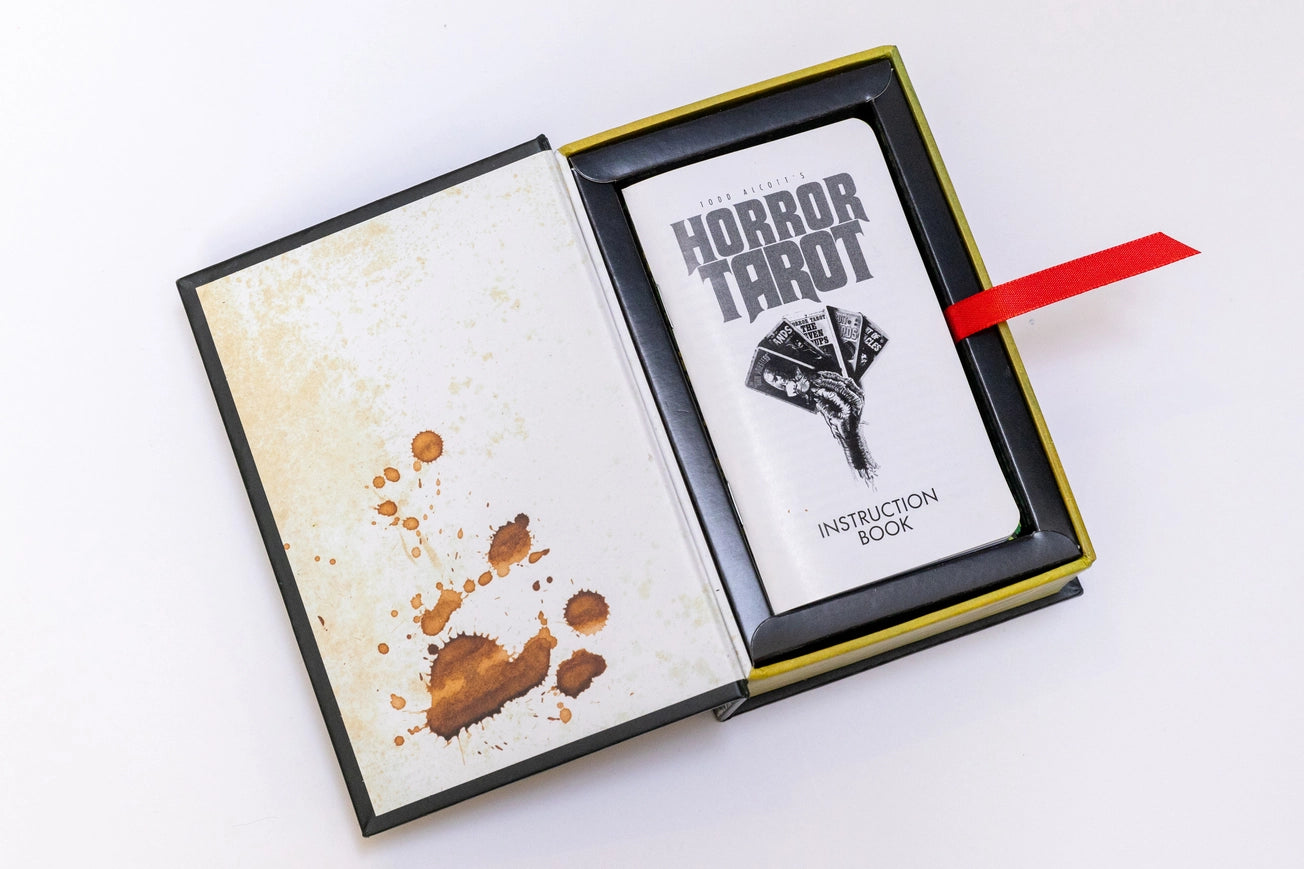 Horror Tarot book with an instruction booklet on a white background