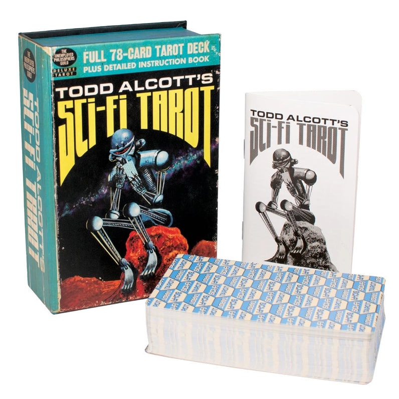 Todd Alcott's Sci-Fi Tarot deck shown with its illustrated outer box, a smaller instruction book, and a stack of cards on a plain white background.