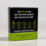 Back side of the Opergeist soap box. Quote on box says, "This wild sage soap won't clear away any ghosts, but it may raise your spirits." Box is black with green accents.