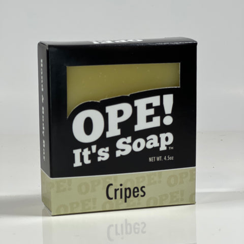 Front side of the Cripes soap. Box is black with cream accents.