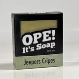 Front side of the Jeepers Cripes soap. Box is black with light mint green accents.