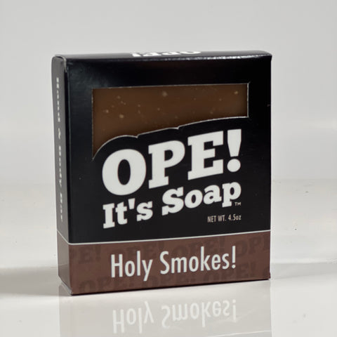 Front side of the Holy Smokes soap. Box is black with brown accents.