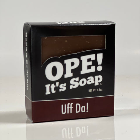 Front side of the Uff Da! soap box. Box is black with maroon accents.