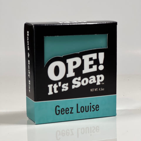 Front side of the Geez Louise soap. Box is black with teal accents.