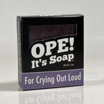 Front side of the For Crying Out Loud soap. Box is black with light purple accents.